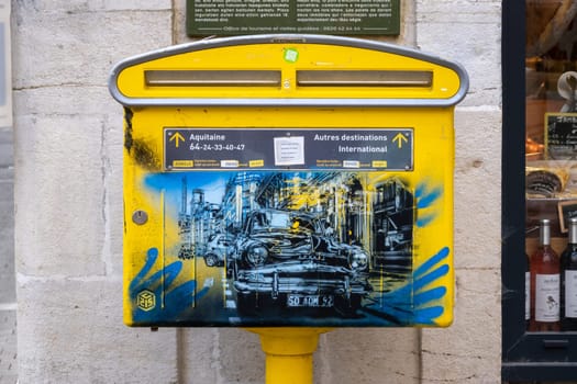 BAYONNE, FRANCE - CIRCA APRIL 2021: Street art on mailbox, vintage Aronde car painting.