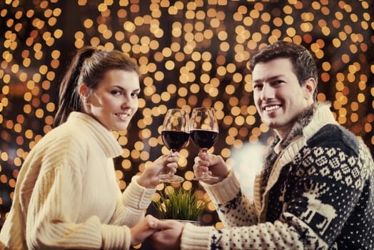 romantic evening date in restaurant  happy young couple with wine glass tea and cake