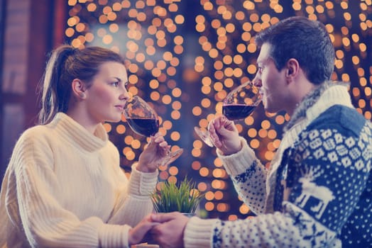 romantic evening date in restaurant  happy young couple with wine glass tea and cake