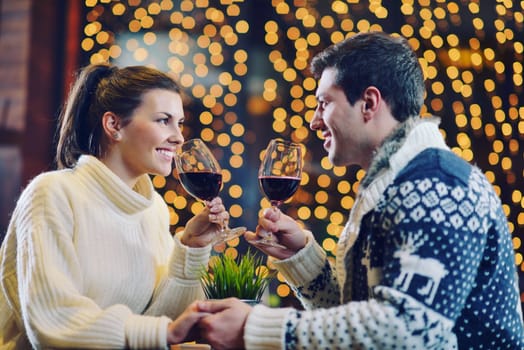 romantic evening date in restaurant  happy young couple with wine glass tea and cake