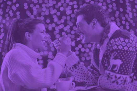 romantic evening date in restaurant  happy young couple with wine glass tea and cake