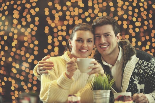 romantic evening date in restaurant  happy young couple with wine glass tea and cake