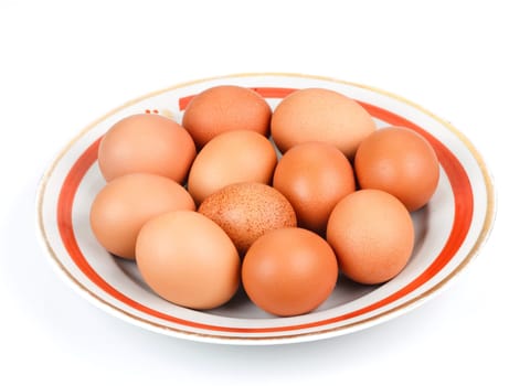 nature chicken eggs in a bowl isolated on white