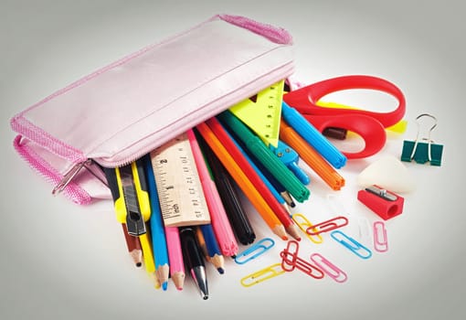 pencil box full of school supplies