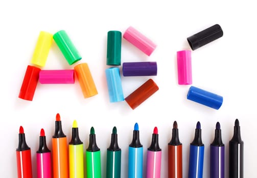 colored markers on the white background