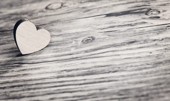 small heart on wooden board