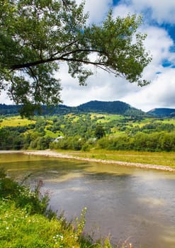Mountain landscape with river and clouds