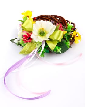 wreath of twigs and flower composition on a white background
