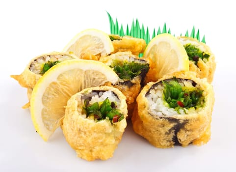 sushi roll fried in tempura batter with lemon isolated