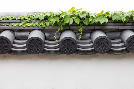 white wall with roofing tiles
