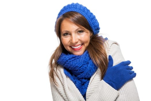attractive pretty young woman with blue wool hat with long dark hair in winter isolated on white background