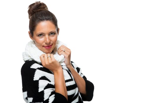 attractive young woman with white wool hat and knitted sweater scarf gloves with dark hair laughing isolated on white background