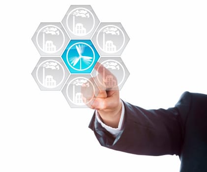 Wind energy icon flashing in blue upon touch by a hand of a business man. The wind power push key is at the center of a circular arrangement of interface buttons depicting factories. Cutout on white.