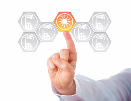 Solar energy button activated in a virtual interface full of smoking factory icons. Metaphor for energy transition, also called Energiewende or energy turn. Cutout isolated on white background.