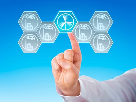 Hexagonal wind power icon selected by touch. Six buttons with smoking factory symbols for conventional energy generation do remain grey. Metaphor. Close up with linear gradient blue background.