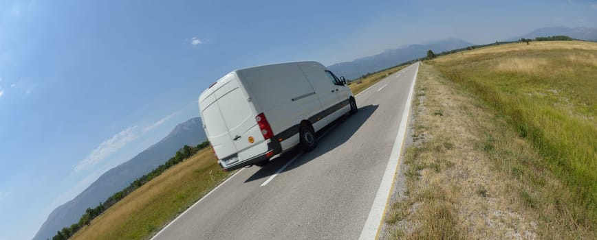delivery cargo van for small business transportation driving fast on road