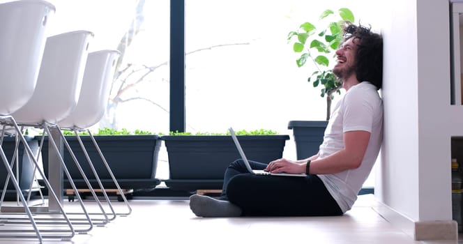 Real man Using laptop on the floor At Home  Enjoying Relaxing