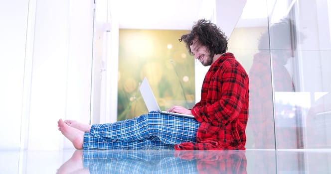 Real man Using laptop on the floor At Home  Enjoying Relaxing