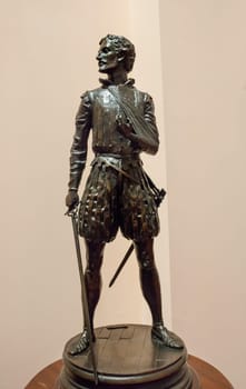 Madrid, Spain - March 6th, 2021: Miguel de Cervantes Saavedra statuette, depicted as Battle of Lepanto soldier. By Sergio Blanco, 1999. Museo Naval de Madrid