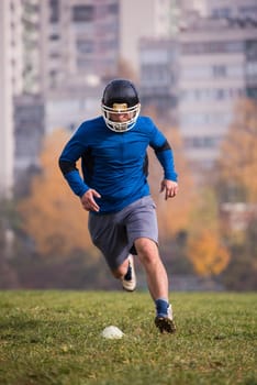 young american football player in action during the training at field