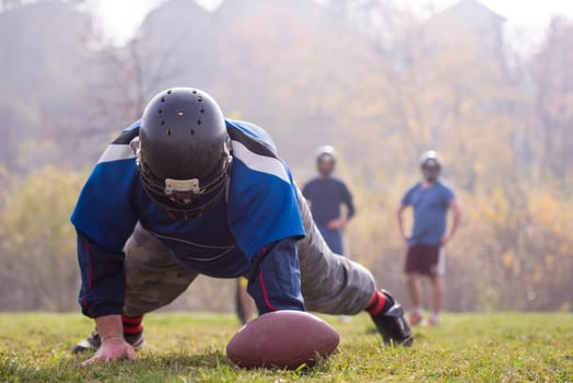 young american football player in action during the training at field