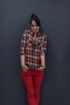 portrait of young startup business woman at modern office, grey chalkboard wall in background