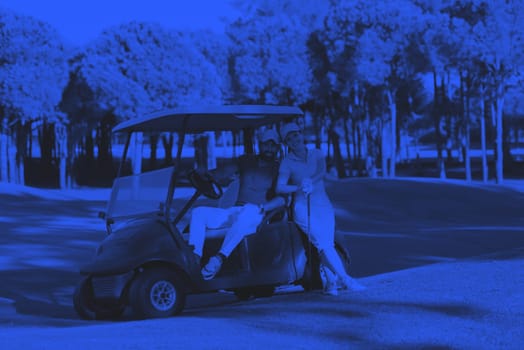 couple in buggy cart on golf course duo tone