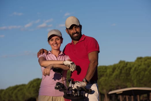 portrait of happy young  couple on golf course