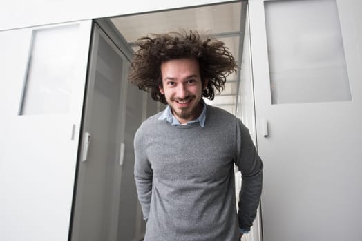 portrait of young handsome IT engeneer in datacenter server room
