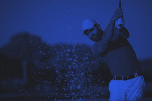 pro golf player shot ball from sand bunker at course duo tone