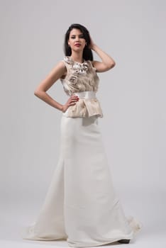 Portrait of beautiful young women in wedding dress isolated on a white background
