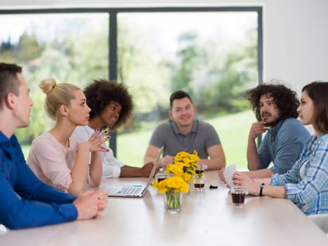 Multiethnic Group of business people discussing business plan  in the startup office