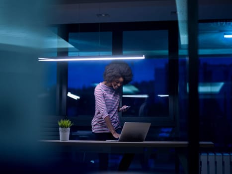 Young african american female Entrepreneur Freelancer Working Using A Laptop In Coworking space