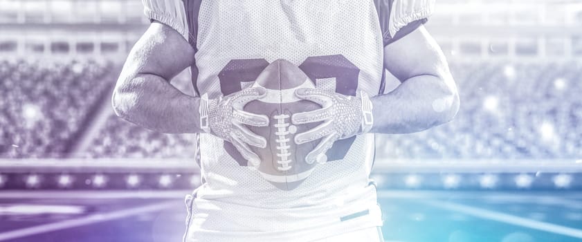Closeup Portrait of a strong muscular American Football Player on big modern stadium field with lights and flares