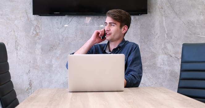 Young Entrepreneur Freelancer Working Using A Laptop In Coworking space