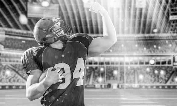 american football player celebrating touchdown on big modern stadium field with lights and flares