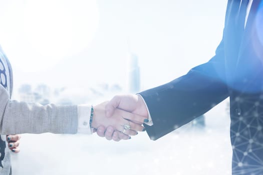close up of businessman and businesswoman handshake