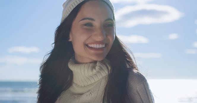 Portrait Of A Young Woman In Autumn Clothes Smiling On The Beach