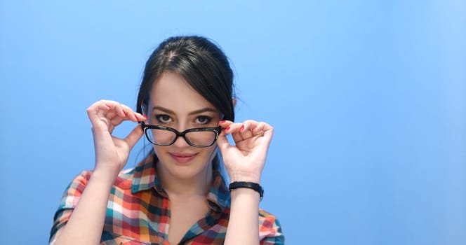 Attractive Young Woman Wearing glasses on colorfull background
