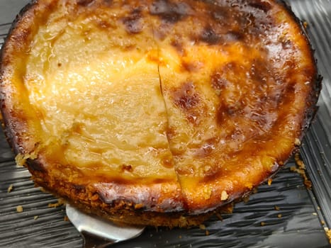 Whole apple kuchen cake in fall setting.