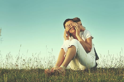 happy young woman mother play and outdoor with beautiful child