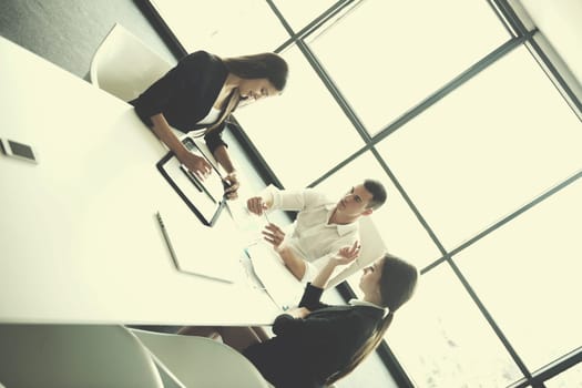 Group of happy young  business people in a meeting at office