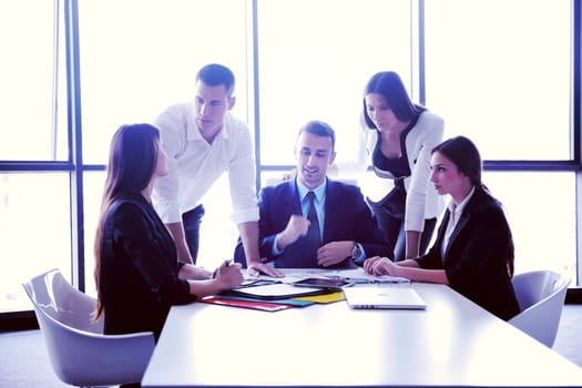 Group of happy young  business people in a meeting at office