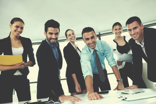 Group of happy young  business people in a meeting at office