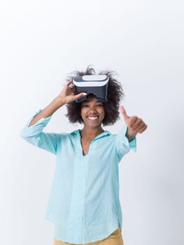 Happy african american girl getting experience using VR headset glasses of virtual reality, isolated on white background