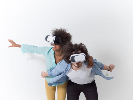 Happy multiethnic couple getting experience using VR headset glasses of virtual reality, isolated on white background