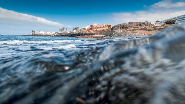 Closeup image of sea waves rolling on the beach.