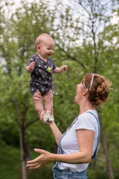 woman with baby have fun in nature