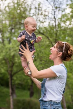 woman with baby have fun in nature