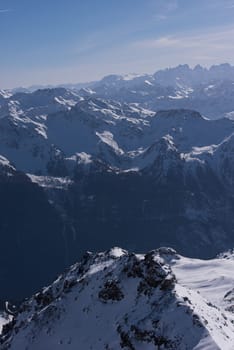 mountain landscape at winter with fresh snow on beautiful sunny day at french alps